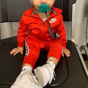 Matching Nike track suits 12M